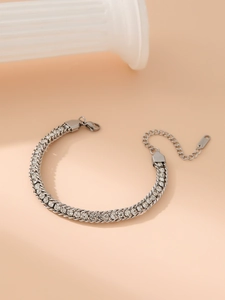 Detail view of silver double-row rhinestone bracelet with adjustable clasp and chain