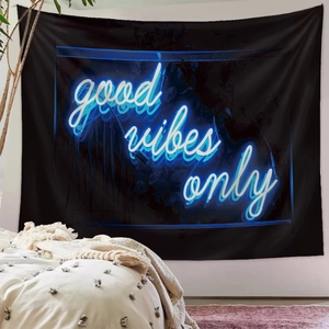 Detail of neon Good Vibes Only text printed on high-quality black wall tapestry fabric