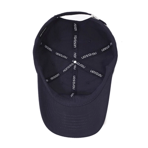 Inside view of navy blue cotton baseball cap showing six-panel structure and metal buckle