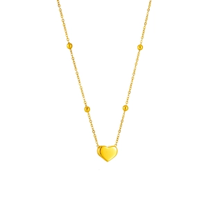 Collier minimaliste avec pendentif cœur doré et perles rondes sur chaîne polie