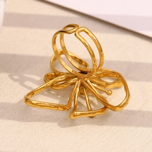 Detailed macro view of 18K gold plated butterfly ring with wire mesh design