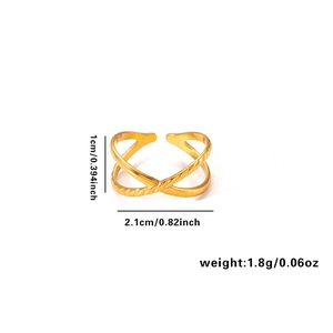 Macro shot of gold cross-shaped geometric open ring with dimensions and weight labels