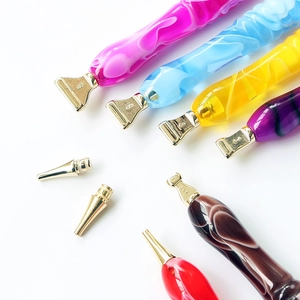 Colorful resin diamond painting pens with multiple stainless steel metal tips on white background