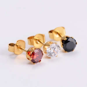 Close-up of three pairs of round-cut zircon stud earrings in red, white, and black stones