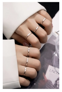 Detail of silver S925 Scorpio zodiac ring showing minimalist engraving on finger