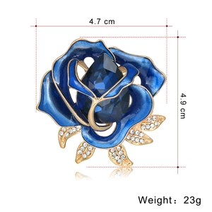 Blue enamel and gold crystal rose brooch with measurements 4.7 cm and weight 23g