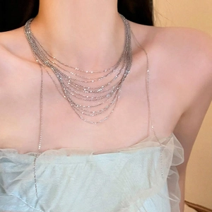 Layered silver choker necklace with multiple chains and metallic tassels for women