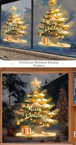 Close-up of golden Christmas tree window sticker with Merry Christmas greeting and gift boxes