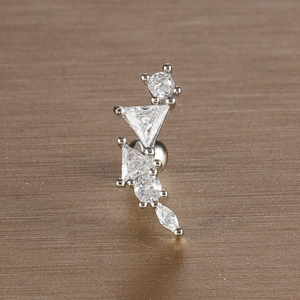 Macro shot of silver leaf ear stud with marquise and round cubic zirconia stones