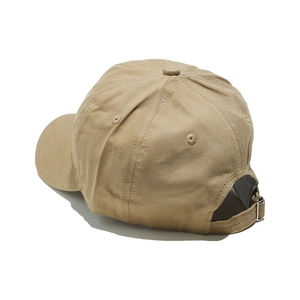 Detail view of khaki cotton baseball cap showing adjustable strap and metal buckle