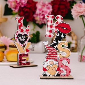 Detail of LOVE and KISS wooden Valentine ornaments with buffalo plaid and gnomes