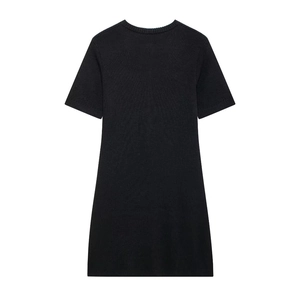 Detail of black knitted short-sleeve dress with textured fabric and classic round neckline
