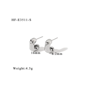 Macro side view of silver C-shaped titanium steel earrings showing 16mm height dimensions