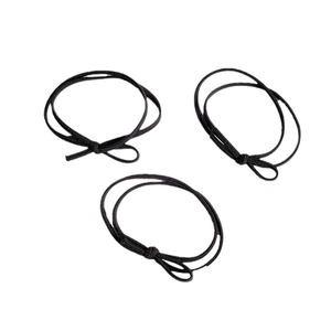 Three-piece set of black high-elastic hair ties with decorative knots on white background