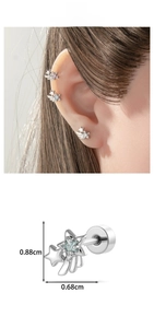Detailed close-up of star wing stud earrings with blue and pink zircon stone accents