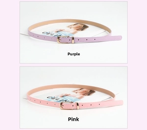 Detail shot of thin women's PU belts in pink and purple with gold pin buckles