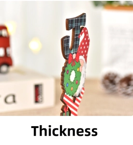 Close-up showing the material thickness and texture of a wooden Christmas gnome ornament