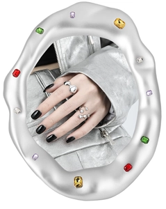 Close-up of a silver irregular S925 sterling silver ring with smooth metallic finish