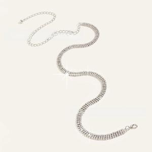 Close-up of sparkling three-row rhinestone waist chain with lobster clasp and extension