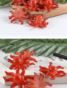 Macro shot of realistic red octopus keychain with detailed suction cup textures
