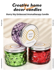 Detailed close-up of embossed star pattern glass jars for velvet rose scented candles