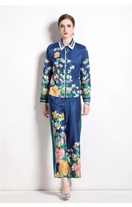 Detail of navy blue floral satin set featuring long sleeve shirt and wide leg trousers