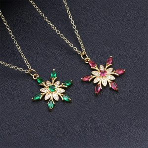 Micro-pave snowflake pendant necklaces in 18K gold plating with red and green zircons