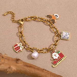 Detailed close-up of 18K gold-plated Christmas bracelet with Santa and reindeer charms