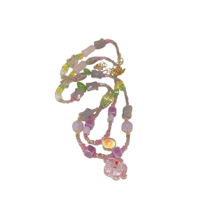 Elegant multi-layered beaded necklace with colorful glass beads and floral pendant