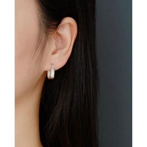 Minimalist double layer square S925 silver hoop earrings shown on a model's ear