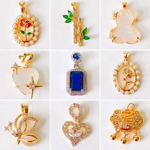 Collection of 18k gold-plated necklaces featuring rose, clover, and butterfly motifs