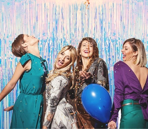 Close-up of sparkling colorful foil fringe curtains for festive party backdrop decorations