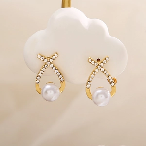 French vintage gold pearl earrings with crossed X-shape and sparkling rhinestones