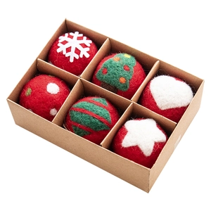 Handmade wool felt Christmas tree balls set with snowflakes in a kraft paper gift box
