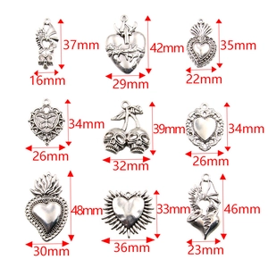 Silver Halloween charms set including skulls and hearts with precise size measurements