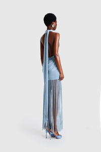 Detail of light blue backless halter dress featuring long fringe and knit fabric textures