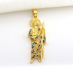 Macro shot of St. Jude religious pendant in gold plating with colorful zircon stones