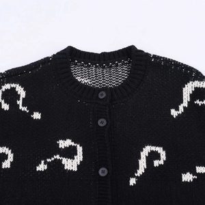 Women's knit cardigan featuring black white question mark jacquard and round neck style