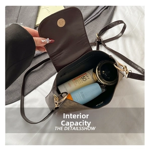 Detail view of large capacity brown retro pattern crossbody bag with magnetic buckle closure