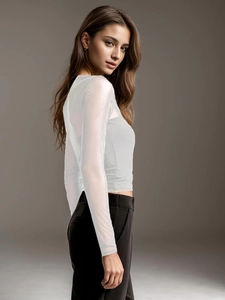 Detail view of white sheer mesh sleeve with elegant see-through fabric on a slim-fit top