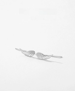 Detail of s925 silver angel wing earrings featuring sparkling pavé zircon and fine cutouts