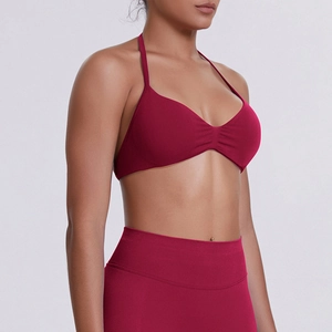Close-up of deep red seamless yoga set with high elasticity and halter sports bra