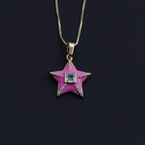 Detailed view of gold necklace with pink enamel star pendant and zircon stones