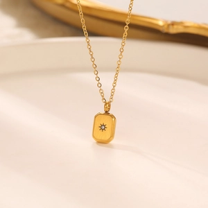 Vintage gold starburst pendant necklace for women with sparkling center zircon crystal
