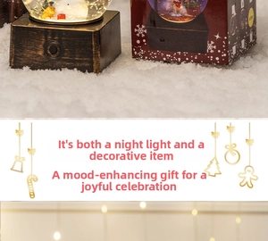 Illuminated Christmas snow globe with winter scene, wooden base, and gift box set