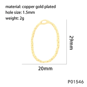 Macro detail of oval copper gold plated pendant with textured hammered surface and dimensions