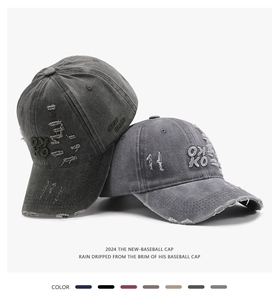 Detailed close-up of 3D letter embroidery and vintage distressed cotton baseball cap