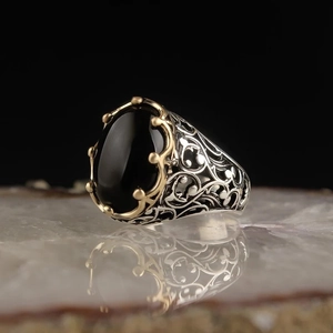 Retro punk men's silver ring with oval black gemstone and golden claw settings