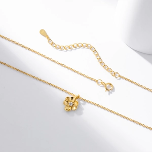 Detailed macro view of S925 sterling silver flower pendant with clear zircon inlay