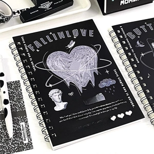 Detail of black matte spiral notebook with liquid metal heart and David sculpture design
